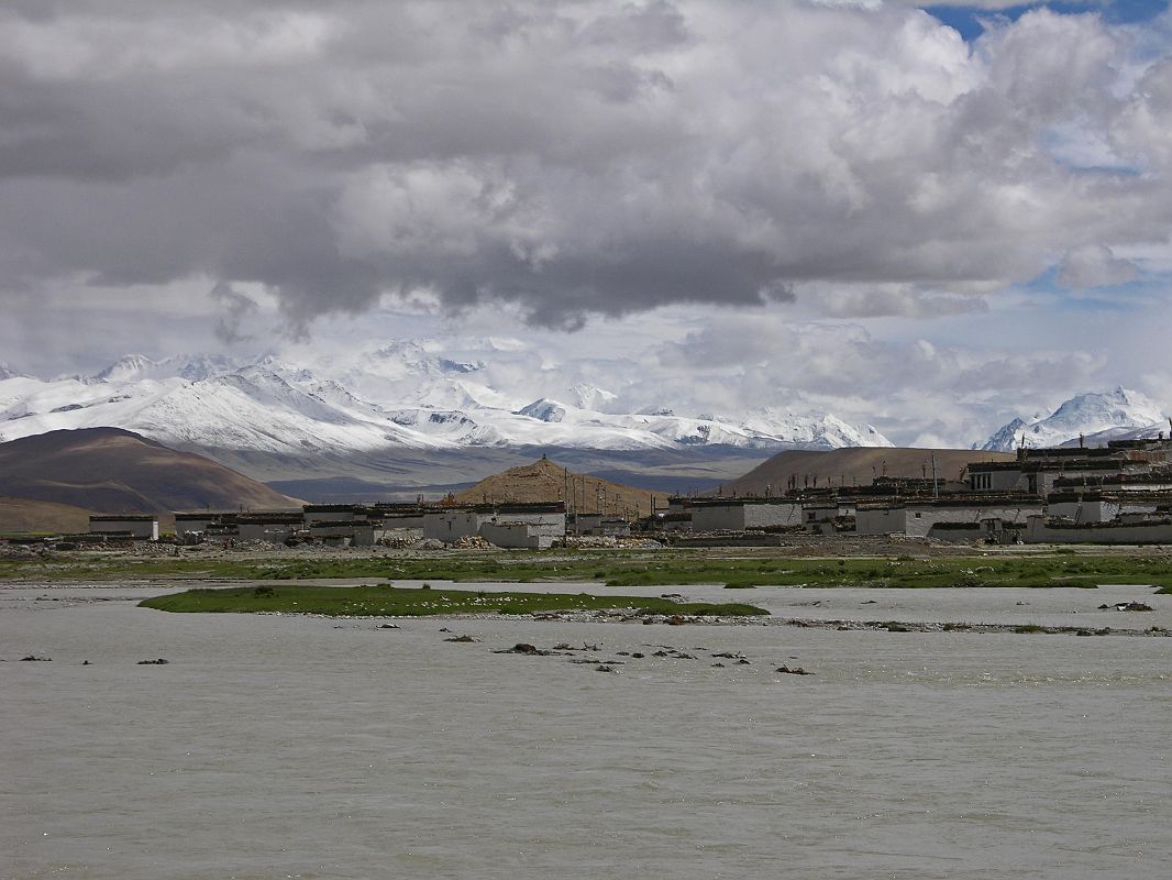 17 Cho Oyu With Monsoon Flooded Tingri Plain And Tingri Village In 2005 To the south of Tingri beyond the monsoon flooding is Cho Oyo (8201m). To Cho Oyus right is the Nangpa La pass (5800m) and then Jobo Rabzang. The Nangpa La pass leads from Tibet to the Solo Khumbu region of Nepal by way of Thame and Namche Bazaar. The pass is normally open only from May to August. Jobo Rabzang (6666m) has impressive rock and ice towers just northwest of Nangpa La near the border of Nepal and Tibet.